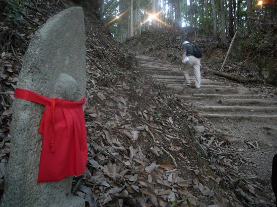 Jizo stone statues are placed all along the mountain path.